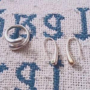 Silver 925 adjustable ring and matching earrings.